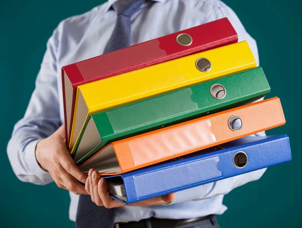 Businessman giving folders to you — Stock Photo, Image