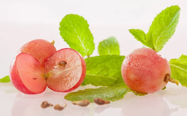 Fresh appetizing grapes and mint leaves — Stock Photo, Image