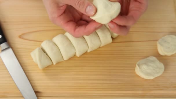 Hands cutting  dough for  dumplings — Stock Video