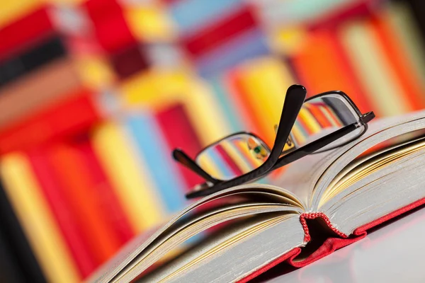Opened book and glasses — Stock Photo, Image