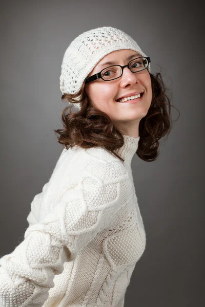Portrait of a beautiful young brunette wearing chochet hat and spectacles — Stock Photo, Image