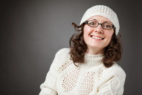 Portrait of a beautiful young brunette wearing chochet hat and spectacles — Stock Photo, Image