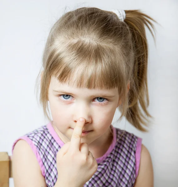 Little girl touching her nose — Stock Photo, Image