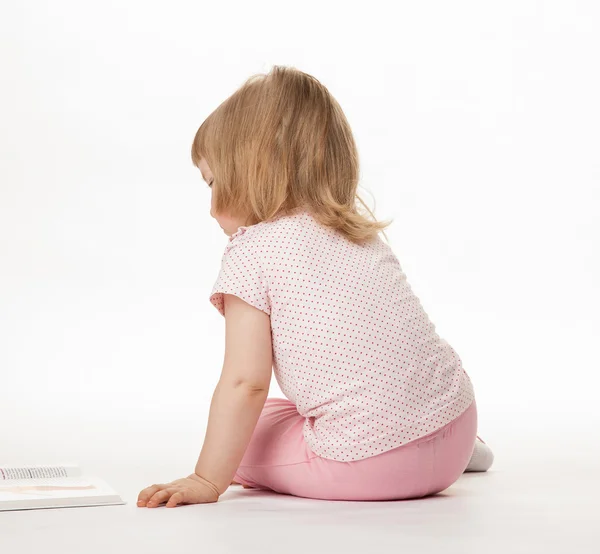 Little child sitting on the floor — Stock Photo, Image