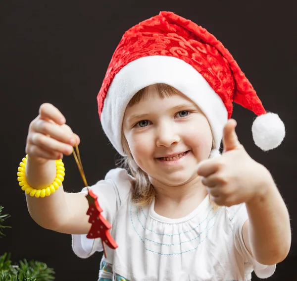 Girl decorates the Christmas tree — Stock Photo, Image
