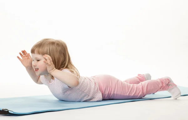 Pretty baby girl exercising — Stock Photo, Image