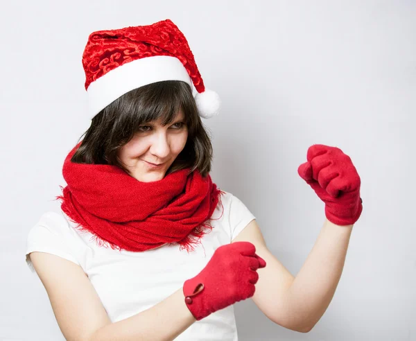 Funny girl in santa's hat boxing — Stock Photo, Image