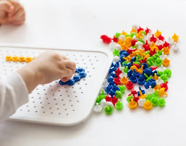 Little child playing with mosaic — Stock Photo, Image