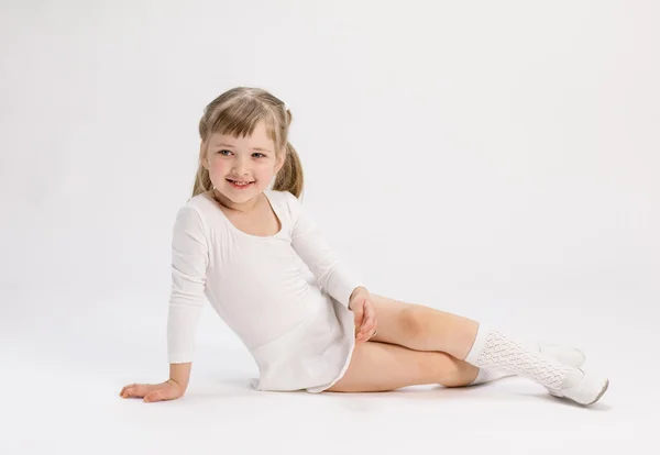 Pretty little girl  doing exercise — Stock Photo, Image