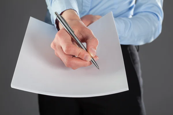 Businesswoman reaching out documents — Stock Photo, Image