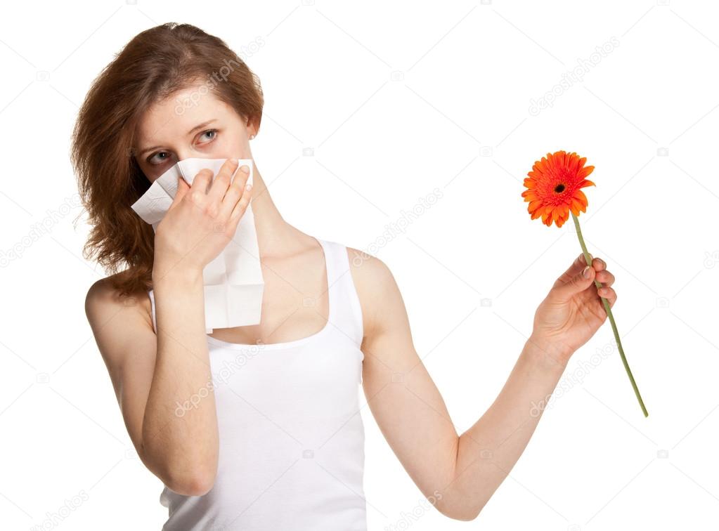 Woman having allergy from spring flowers 