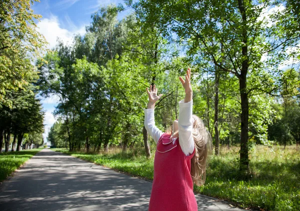 Little girl catching something — Stock Photo, Image