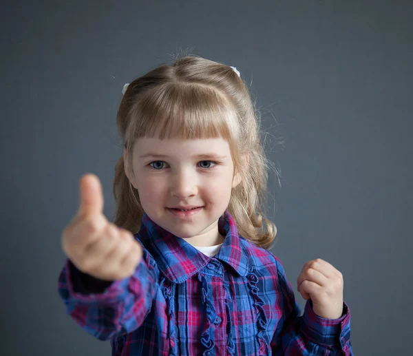 Niña mostrando el pulgar hacia arriba —  Fotos de Stock