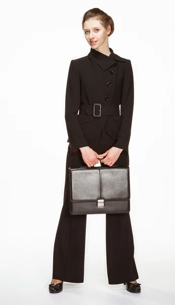Молодая женщина в деловом костюме с портфелем — стоковое фото