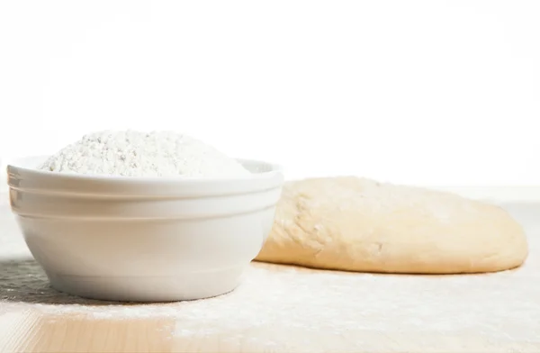 Dough and flour in a plate — Stock Photo, Image