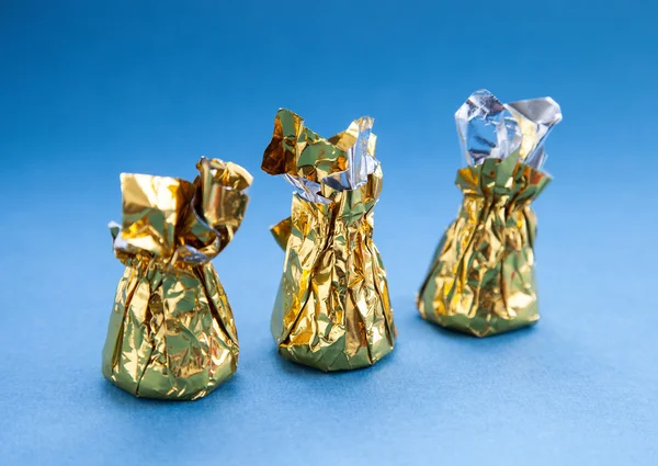 Słodyczy w złotej folii — Zdjęcie stockowe