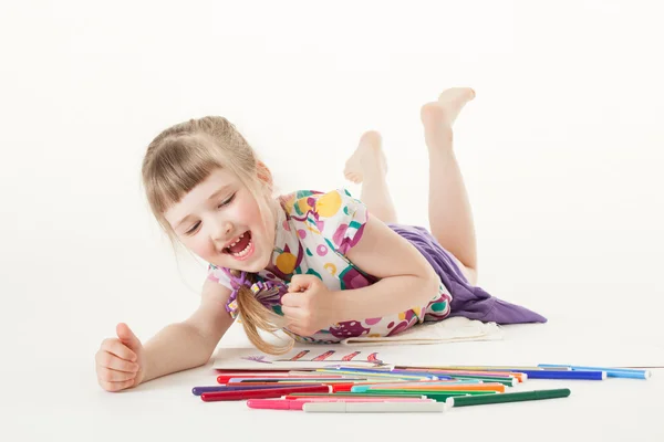 Pretty little girl choosing a felt-tip pen — Stock Photo, Image