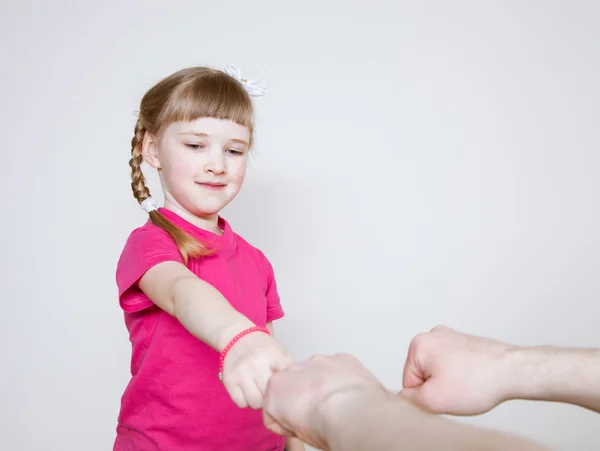 Pretty little girl playing with her father — Stock Photo, Image