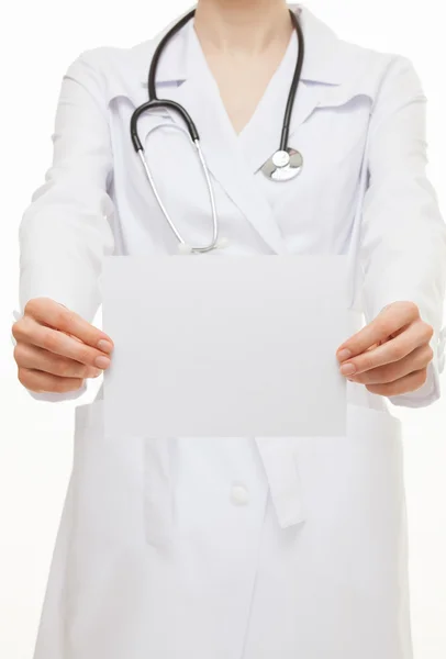 Doctor holding an empty sheet of paper — Stok fotoğraf