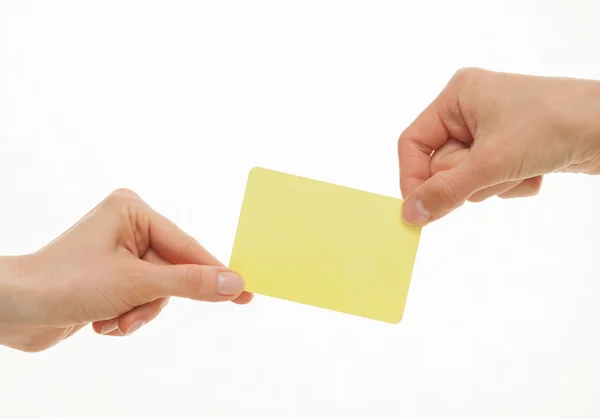 Hands pull in different directions an card — 图库照片