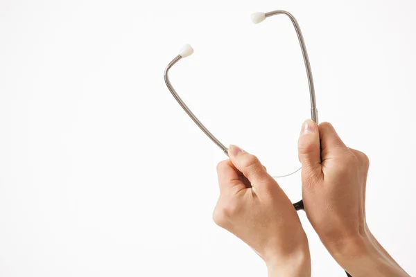 Hands holding a stethoscope — Stock Photo, Image