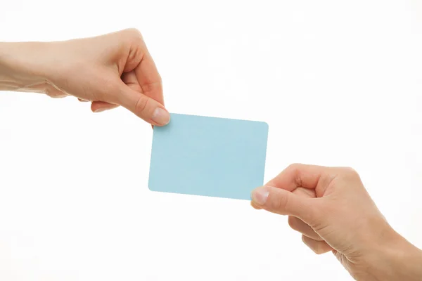 Two hands pull in different directions a blue paper card — Stock Photo, Image