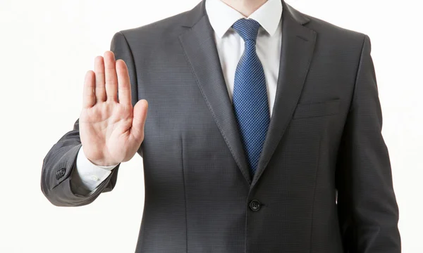 Businessman showing an empty palm — Stock Photo, Image