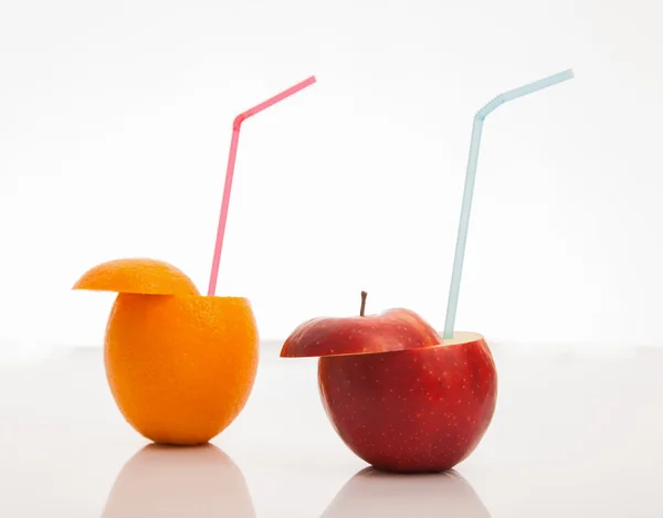 Cocktail straws in fresh juicy fruits — Stock Photo, Image