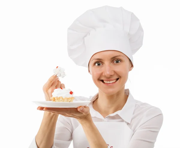 Beautiful woman chef cook showing cak — Stock Photo, Image