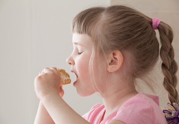 Girl eating a doughnut