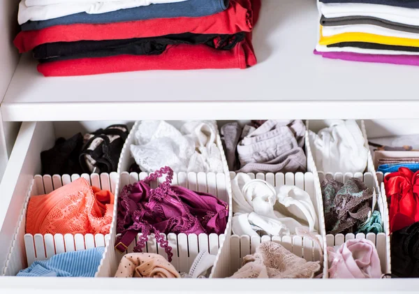 Colorful clothes in a wardrobe — Stock Photo, Image