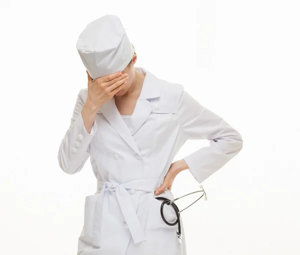 Weary doctor closing her face — Stock Photo, Image