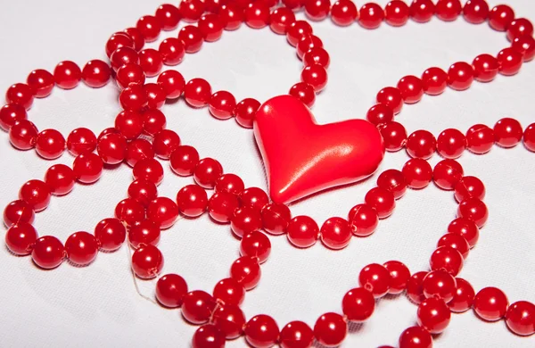 Beads and red heart — Zdjęcie stockowe