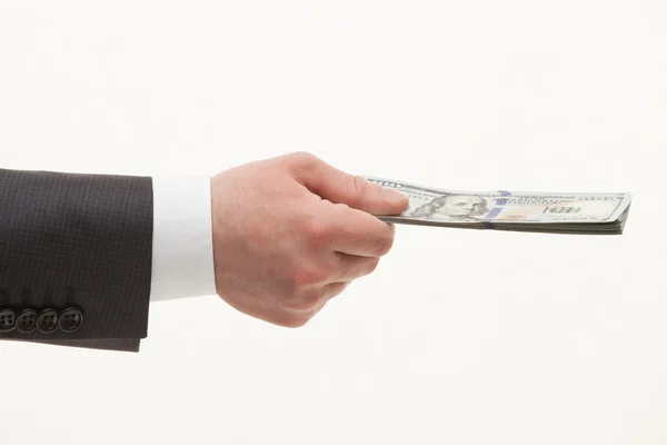 Businesman's hand holding dollars — Stock Photo, Image