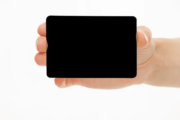 Mano femenina sosteniendo una tarjeta de papel amarillo — Foto de Stock