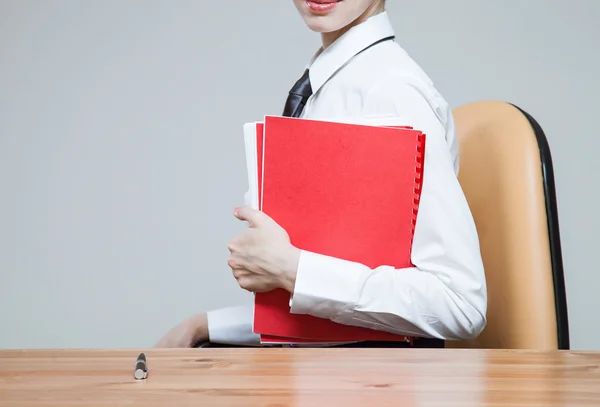 Businesswoman on workplace with folders — Stock Photo, Image