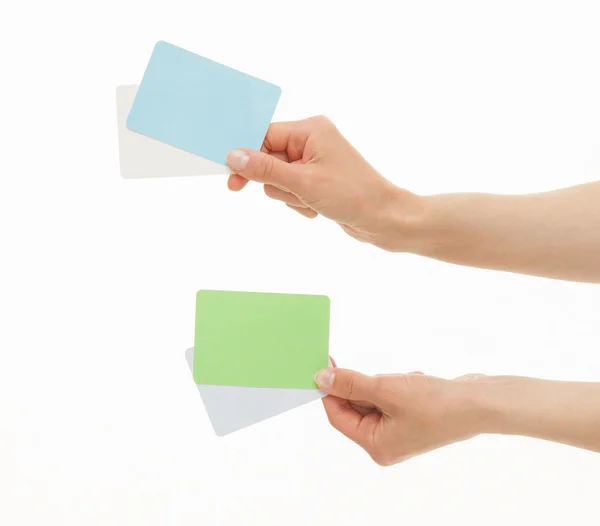 Two hands holding colorful paper cards — Stock Photo, Image