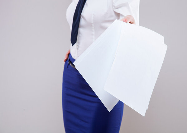 Businesswoman holding documents