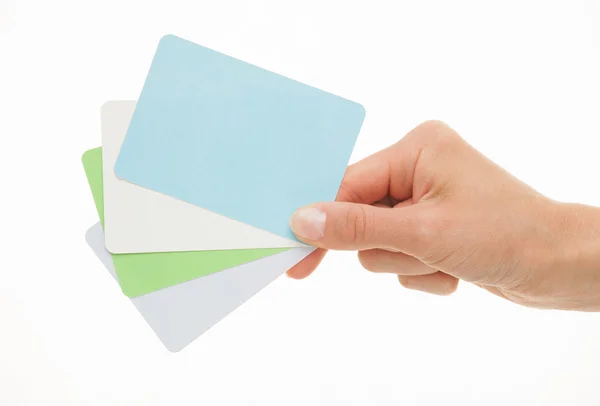 Female hand holding colorful paper cards — Stock Photo, Image