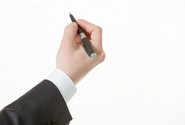 Businessman's hand holding a pen Royalty Free Stock Photos