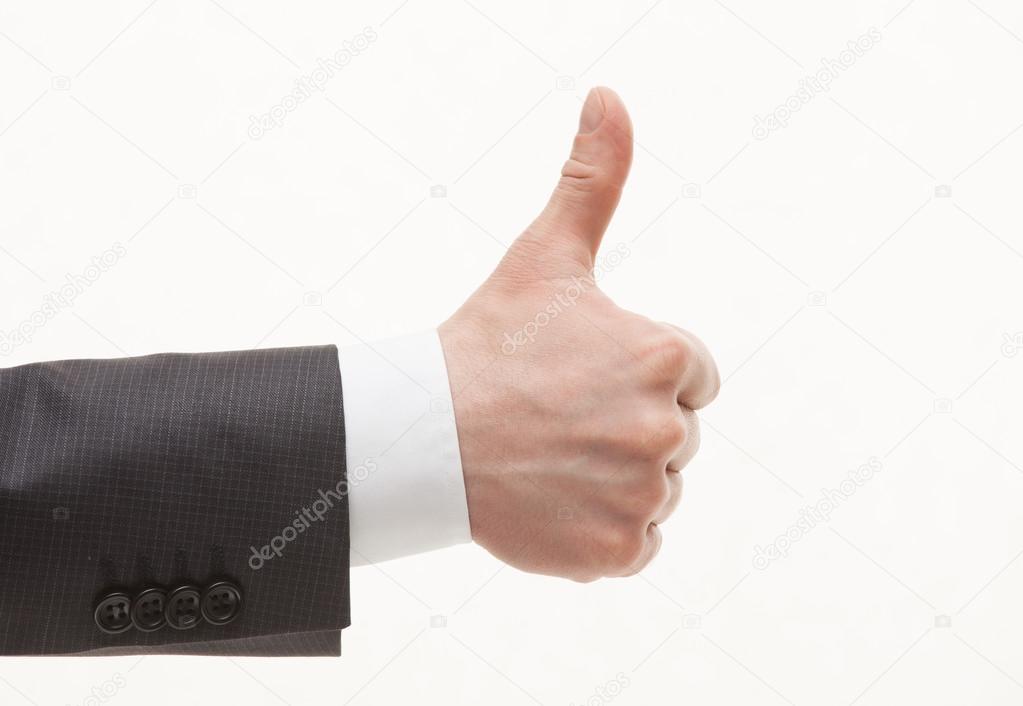 Businesman's hand showing thumd up sign