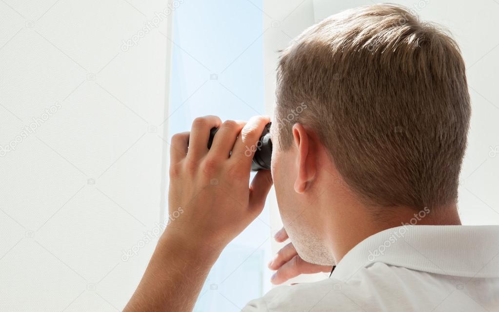 Young man with binocular