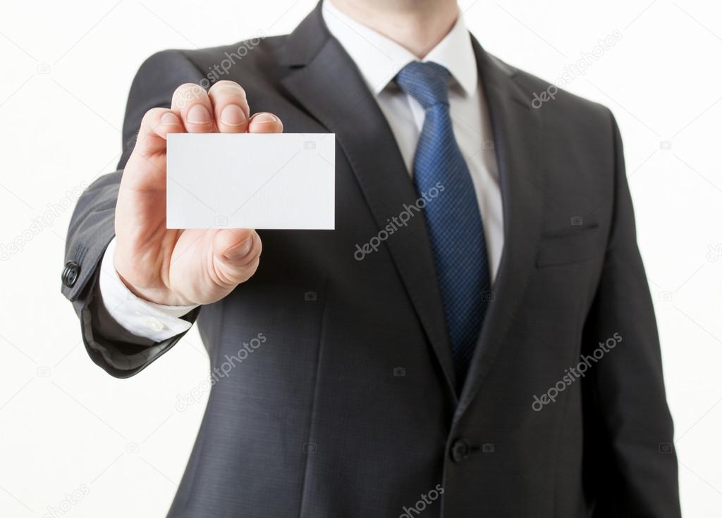 Unrecognizable businessman holding a visiting card