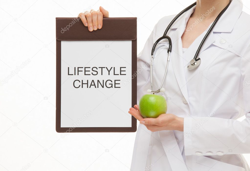 Doctor holding a clipboard and apple