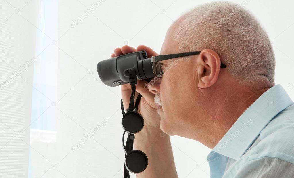 Adult man with binocular 