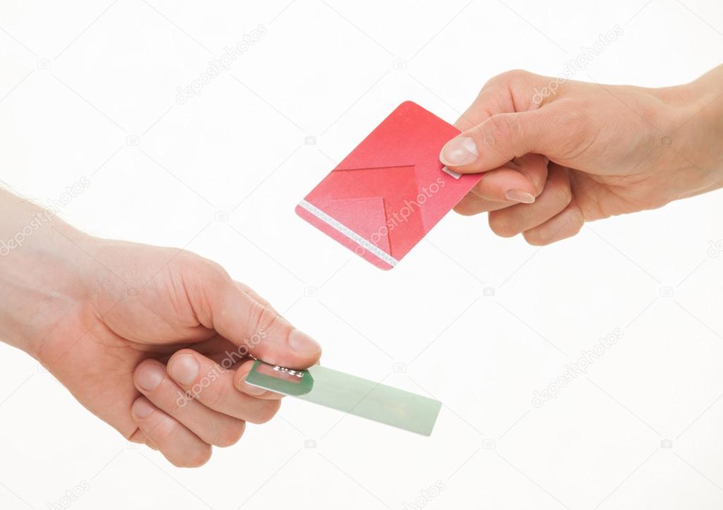 Two business people exchanging plastic cards