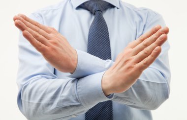 Businessman demonstrating a gesture of a rejection clipart