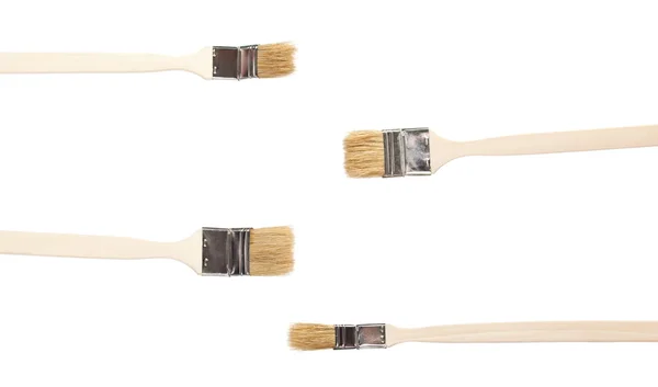 Four construction paintbrushes — Stock Photo, Image