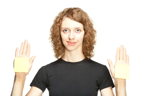 Mujer mostrando pegatinas en blanco — Foto de Stock