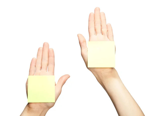 Hands with blank stickers — Stock Photo, Image